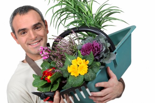 Professional landscaper designing an outdoor space in Hackney